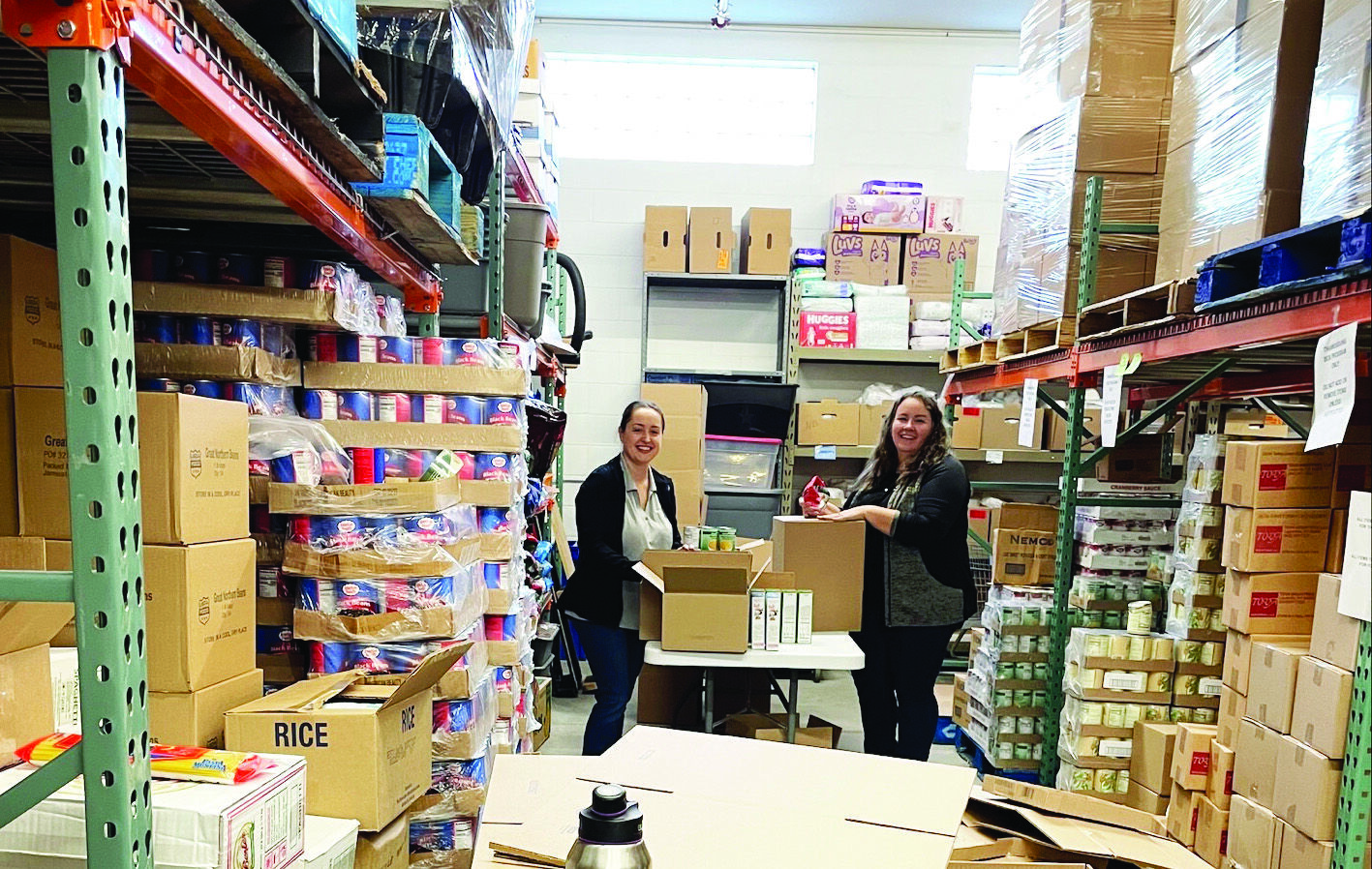 Kris standing with her grandchildre